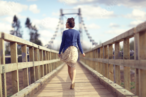 happy girl dress runs over the bridge © kichigin19