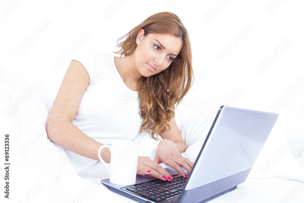 portrait of beautiful young female using a laptop at home portrait of beautiful young female using a laptop at home