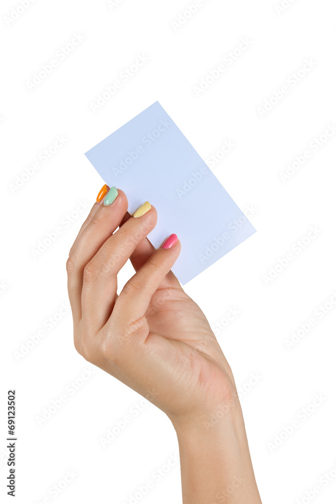 female hand with manicure holding a business card female hand with manicure holding a business card