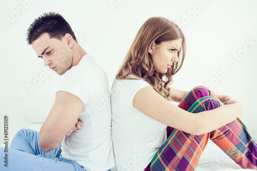 Upset young couple having marital problems