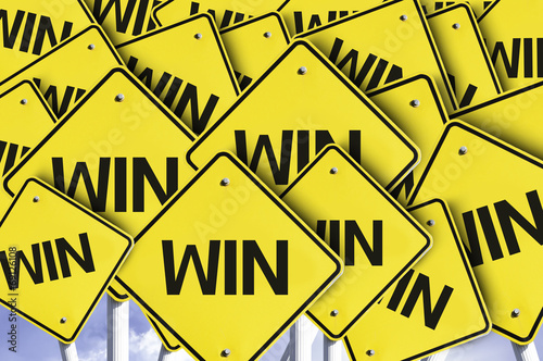 Win written on multiple road sign