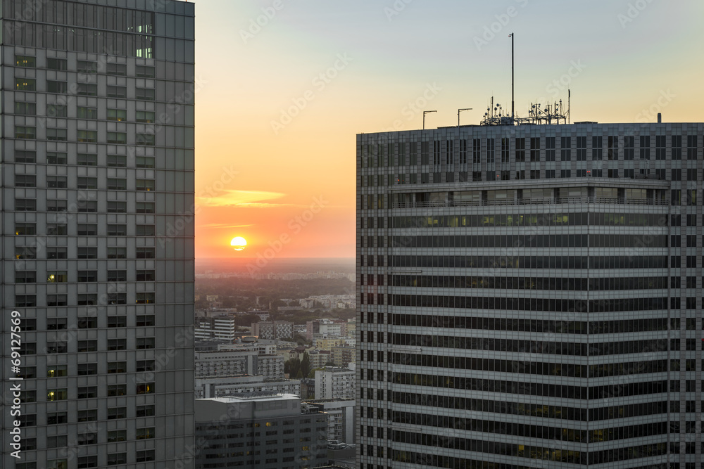 Fototapeta premium Sundown over Warsaw city with modern buildings