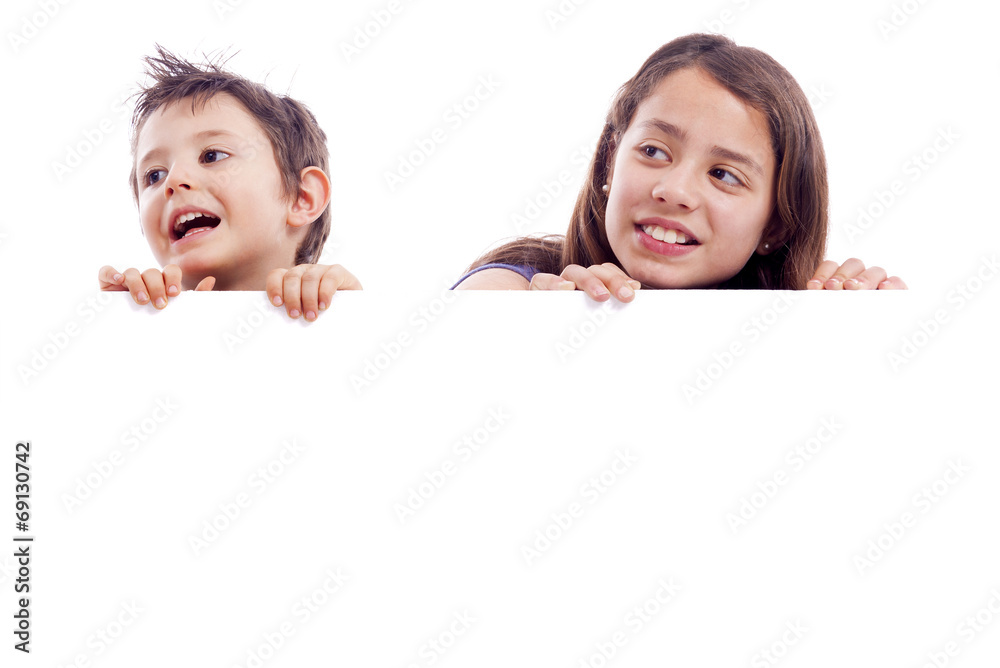 Kids holding a white board for text or image, isolated on white Kids holding a white board for text or image, isolated on white