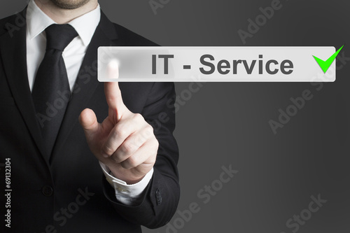 businessman pushing button it service checked