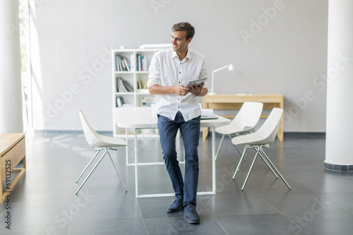 Young man with tablet in th...