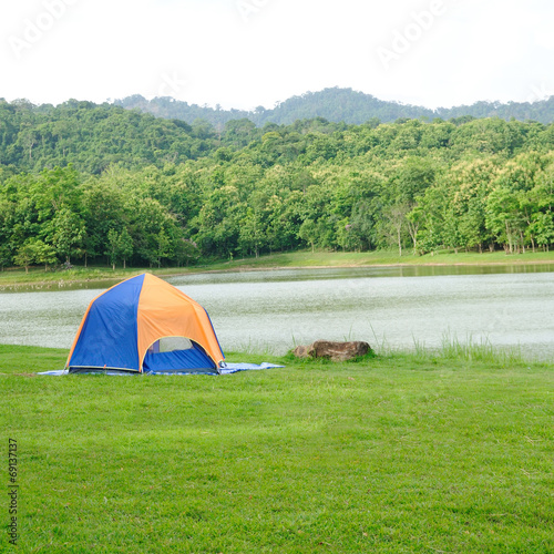 Single tent on green yard  camping.