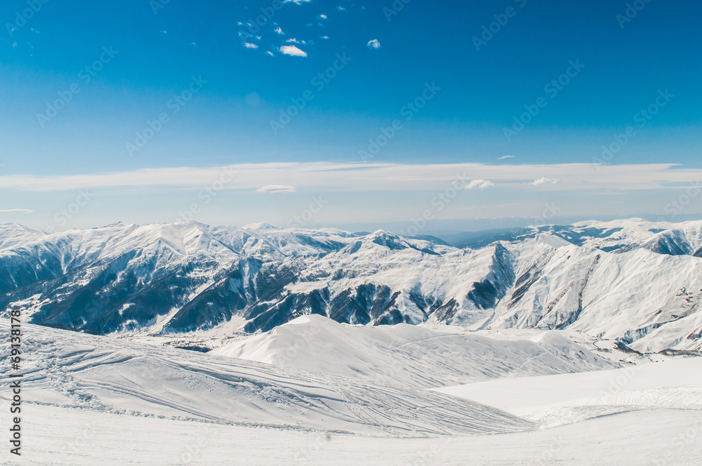 Snow mountains on bright winter day