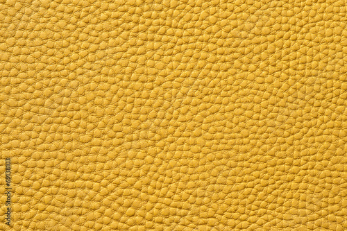 Closeup of seamless yellow leather texture