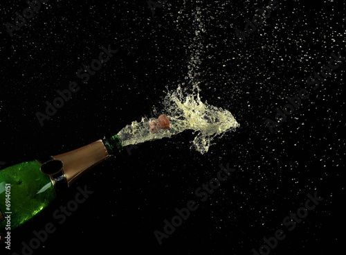 Champagne splashes on black background