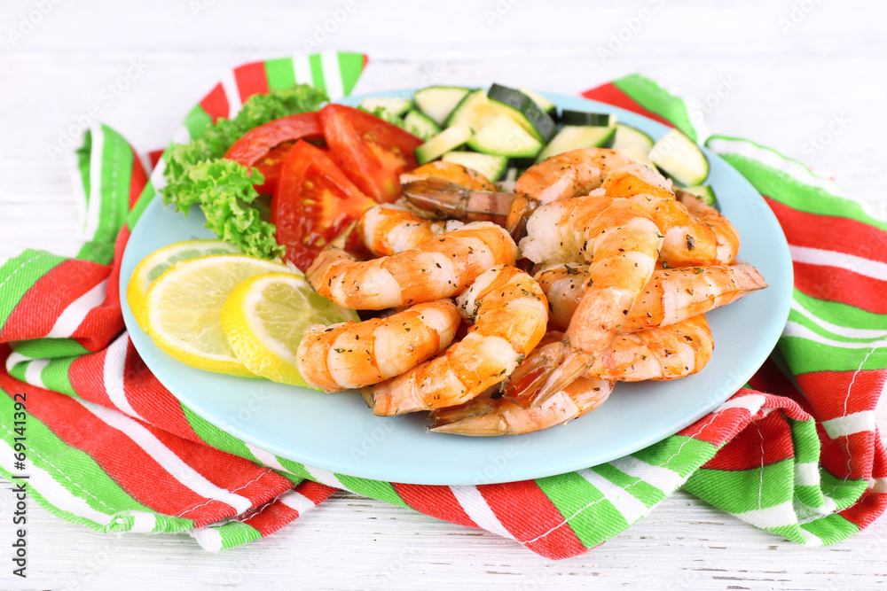 Plate of fresh boiled prawns with tomatoes, lettuce, lemon and Plate of fresh boiled prawns with tomatoes, lettuce, lemon and