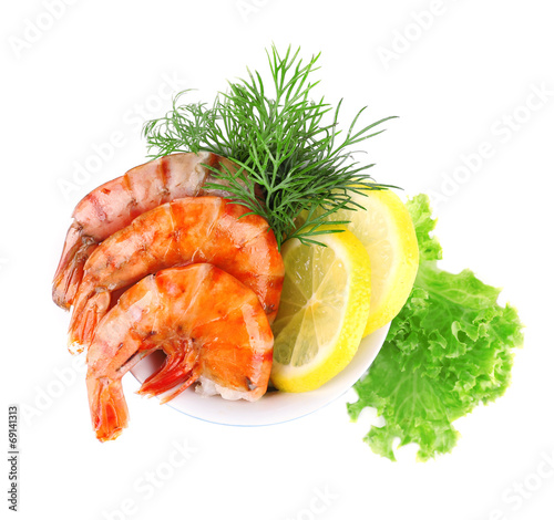 Fresh boiled prawns with dill and lemon in a blue round bowl