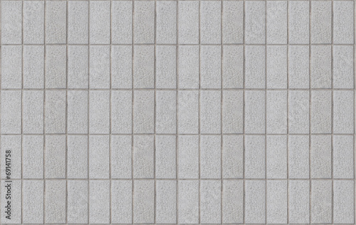 A grey tile wall