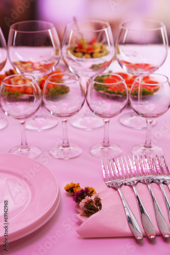 Buffet table with dishware waiting for guests