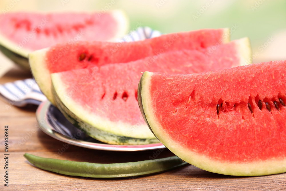 Fresh slice of watermelon on table outdoors, close up Fresh slice of watermelon on table outdoors, close up