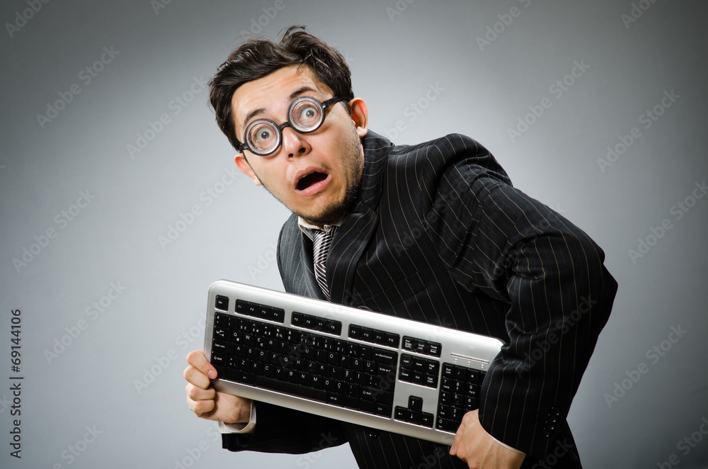 Comouter geek with computer keyboard Comouter geek with computer keyboard