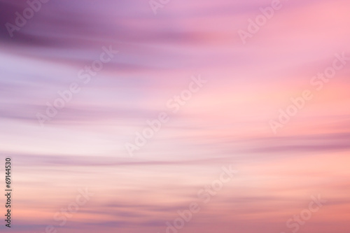 Defocused sunset sky background  with blurred panning motion. © volgariver