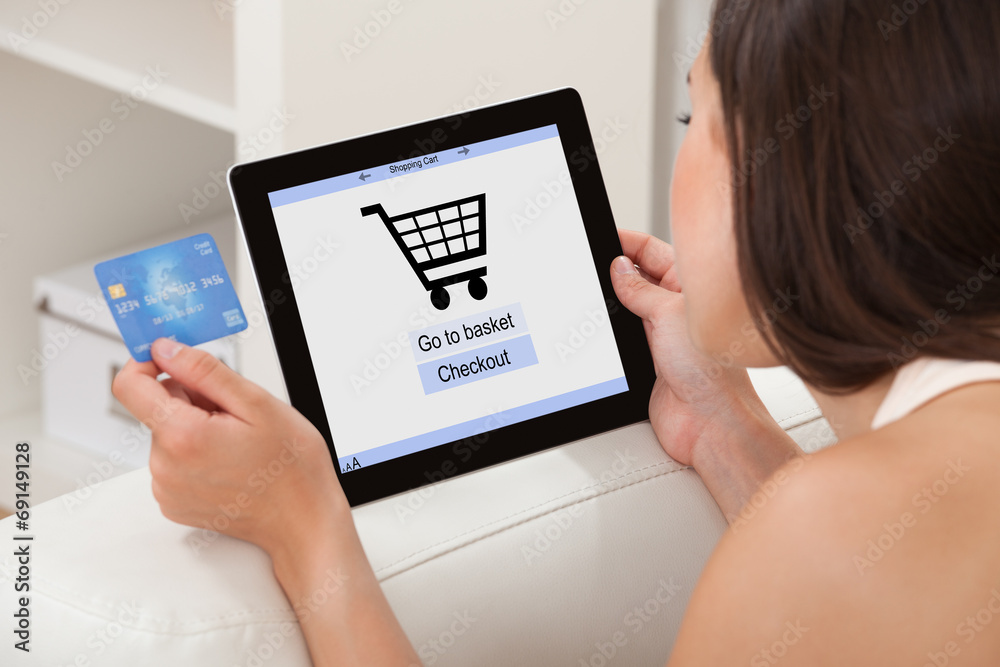 Woman With Credit Card Shopping Online On Digital Tablet