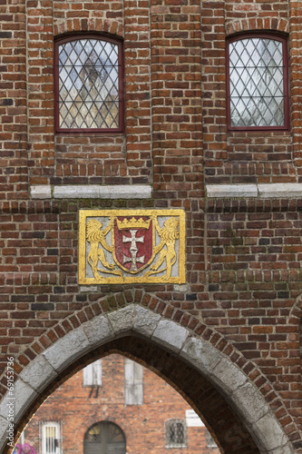 The historic coat of arms on the building #69153736