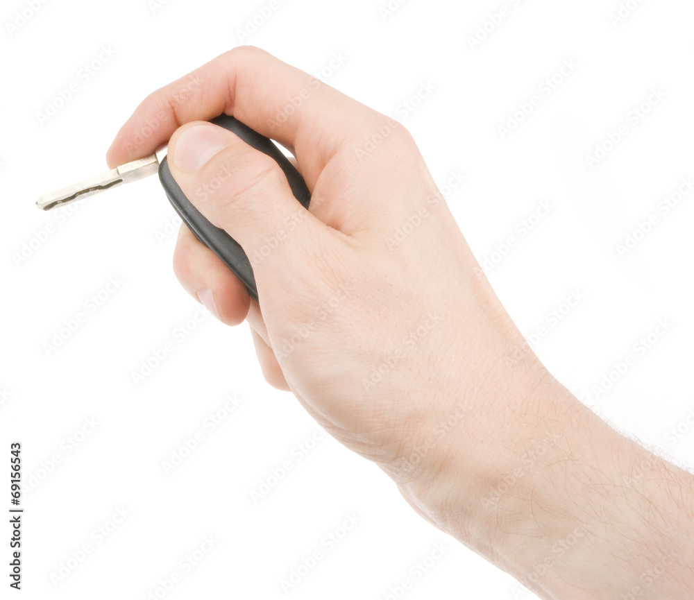 Hand holding car keys isolated on white background Hand holding car keys isolated on white background