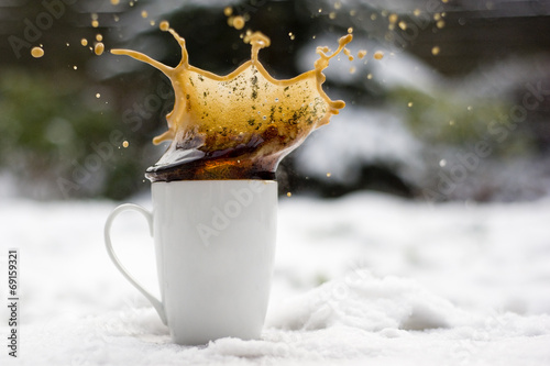 splashing coffee in the snow