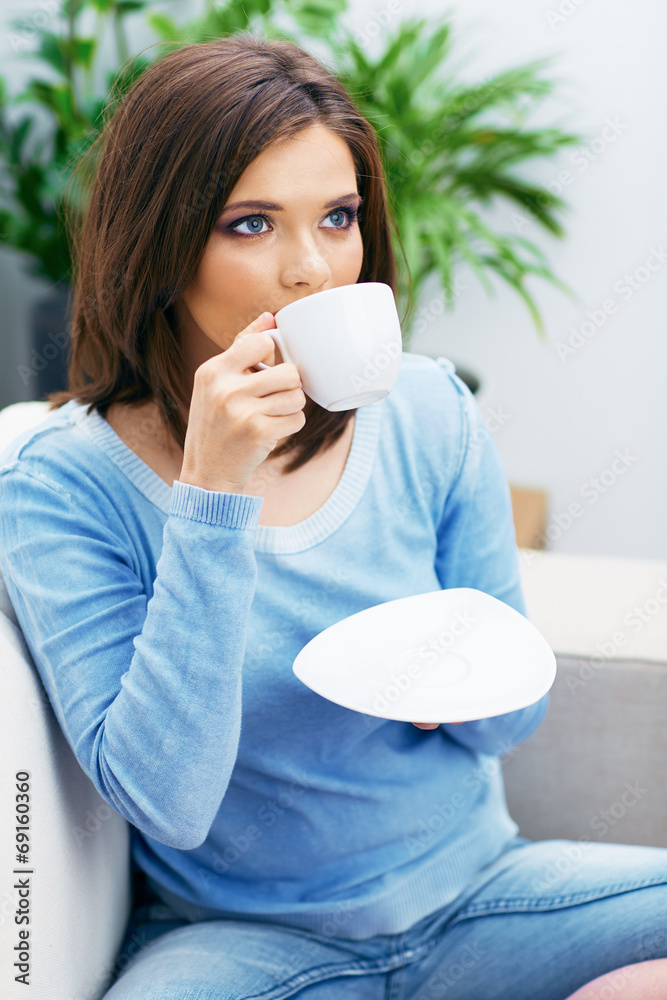 Portrait of young woman drinking coffee Portrait of young woman drinking coffee