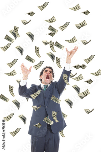 business man catching falling dollars banknotes and screaming