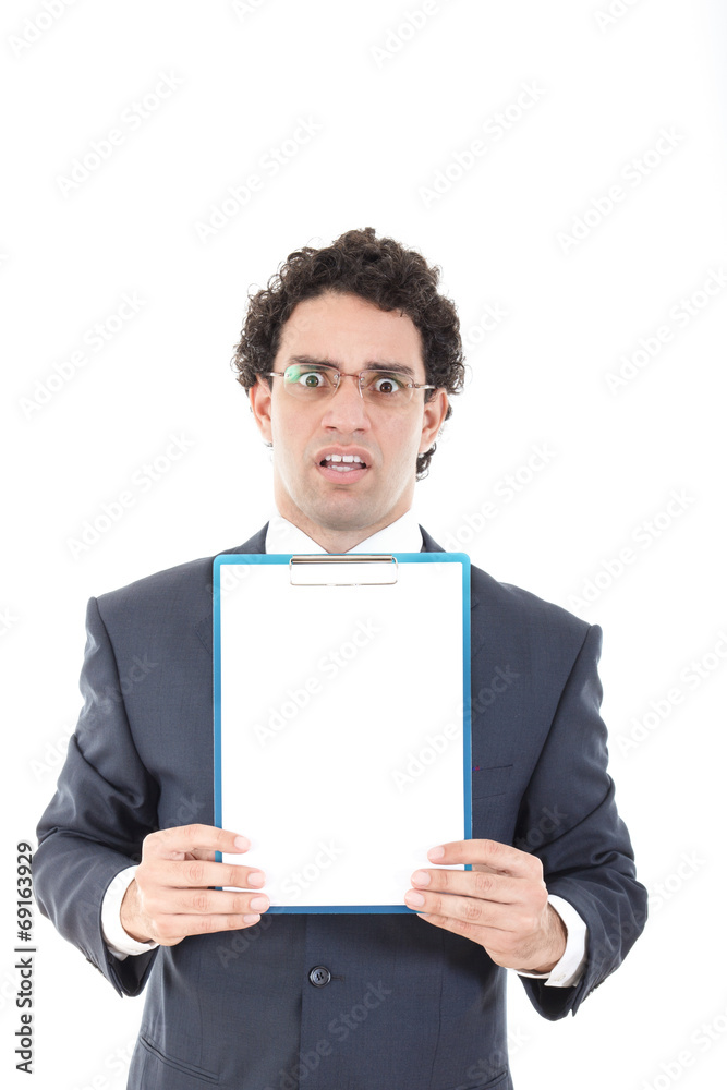 confused and stunned young businessman posing with white board confused and stunned young businessman posing with white board
