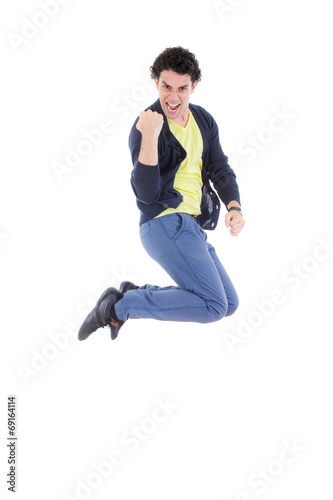 Excited successful man jumping of joy with proud expression