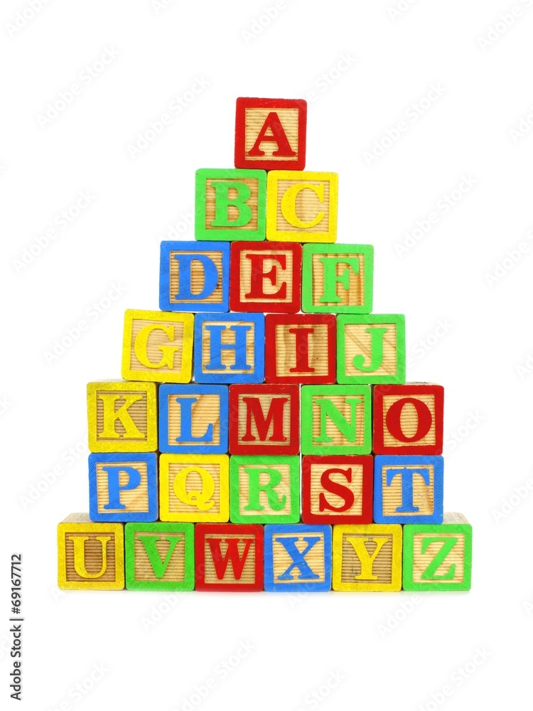 Stack of colorful toy wooden block letters Stack of colorful toy wooden block letters