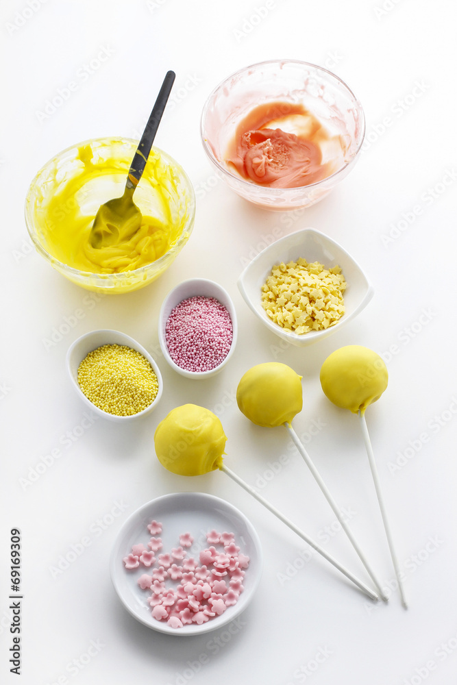 Yellow cake pops isolated on white background Yellow cake pops isolated on white background