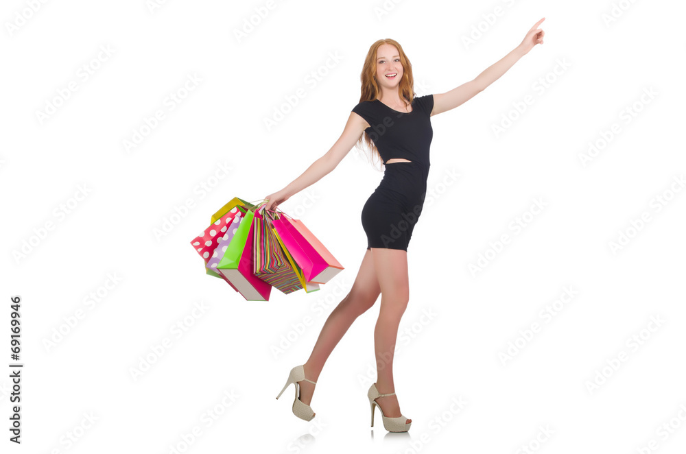 Woman after shopping spree on white