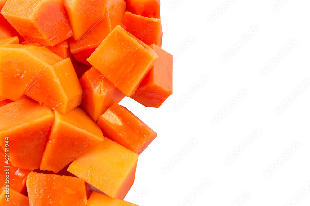 Bite sized papaya fruit over white background Bite sized papaya fruit over white background