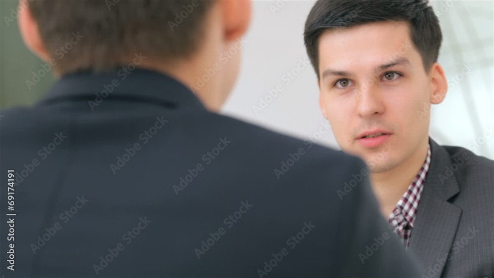 close-up of face, young attractive couple consults close-up of face, young attractive couple consults