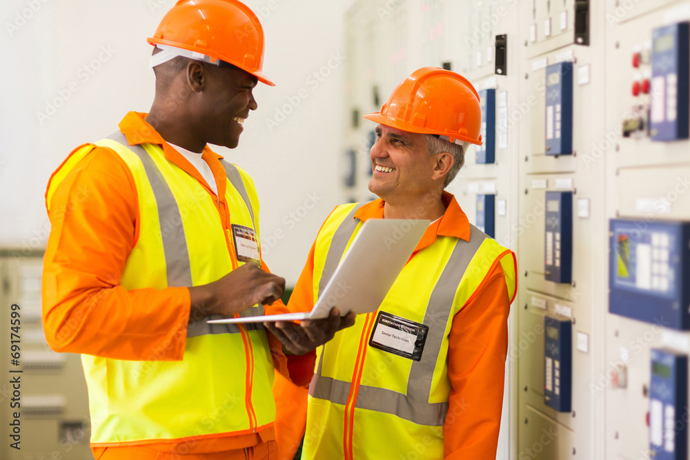 industrial engineers working in control room