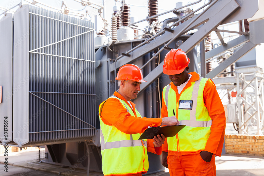electrical engineers discussing work electrical engineers discussing work