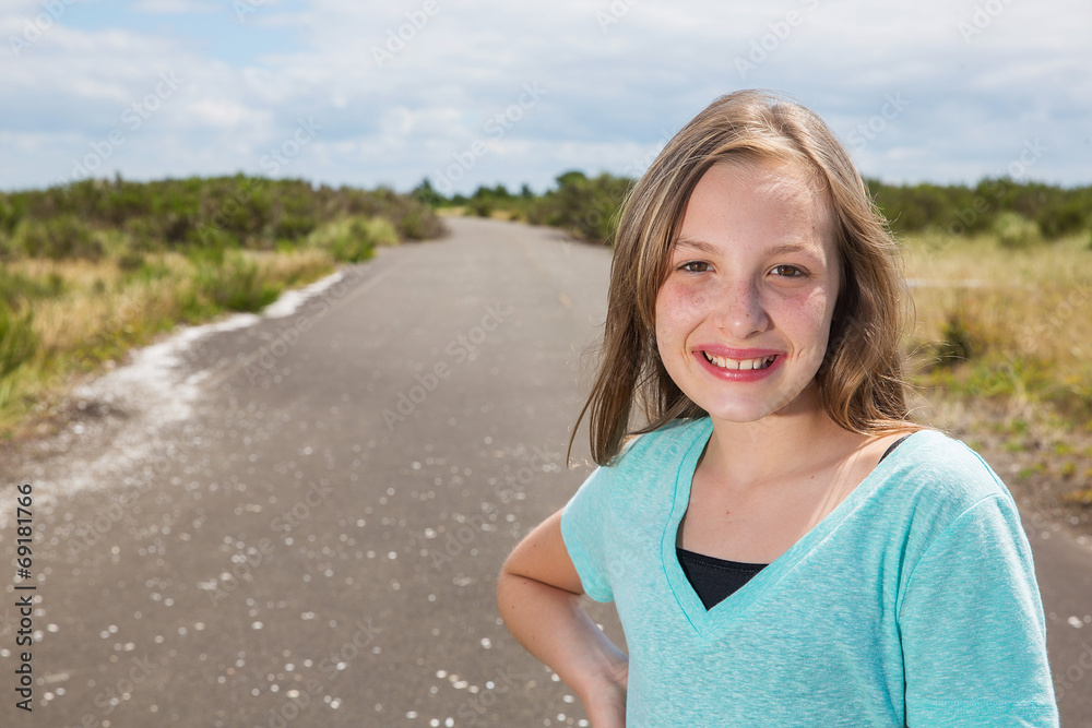 Pretty young girl on a quiet road Pretty young girl on a quiet road