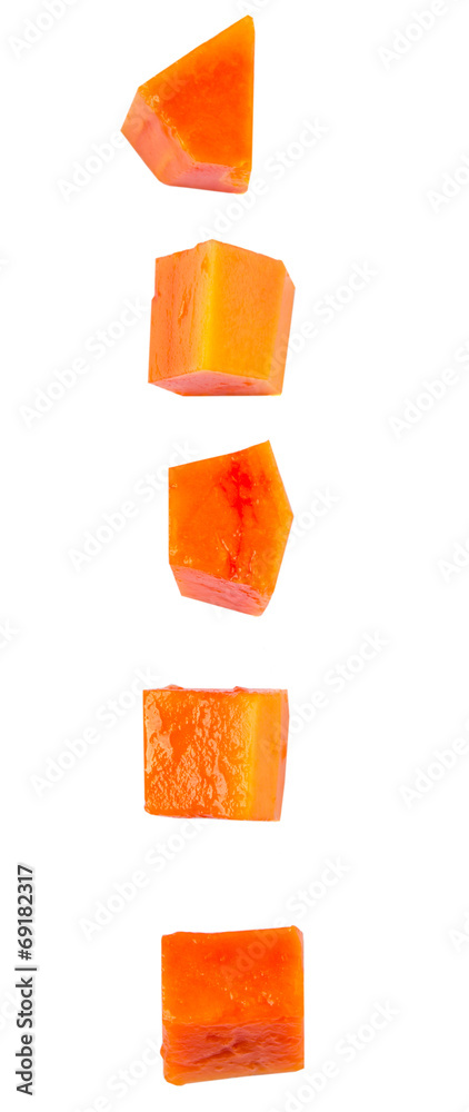 Bite sized papaya fruit over white background Bite sized papaya fruit over white background
