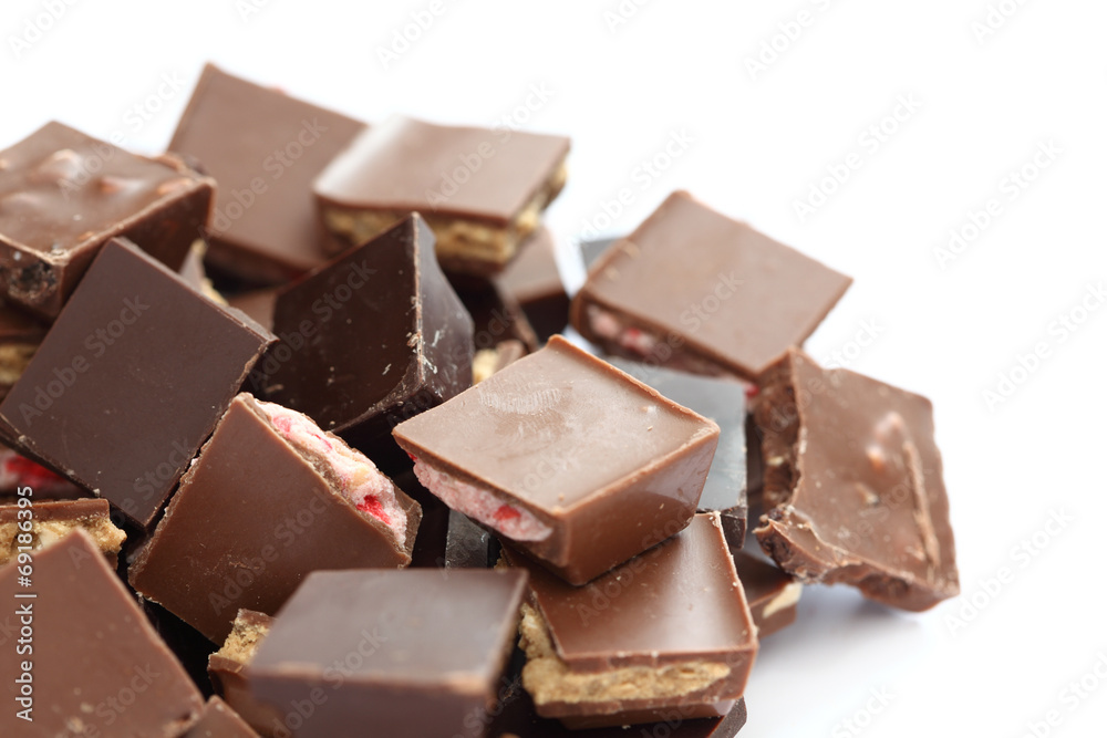 Pieces of chocolate filled with nuts and strawberry Pieces of chocolate filled with nuts and strawberry