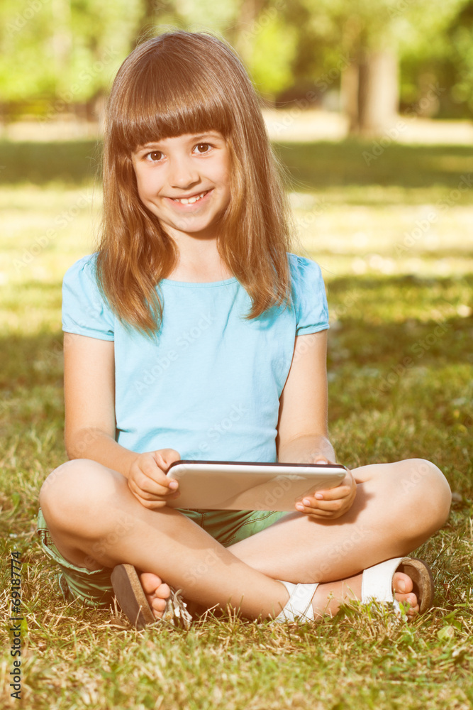 Little girl with tablet computer Little girl with tablet computer