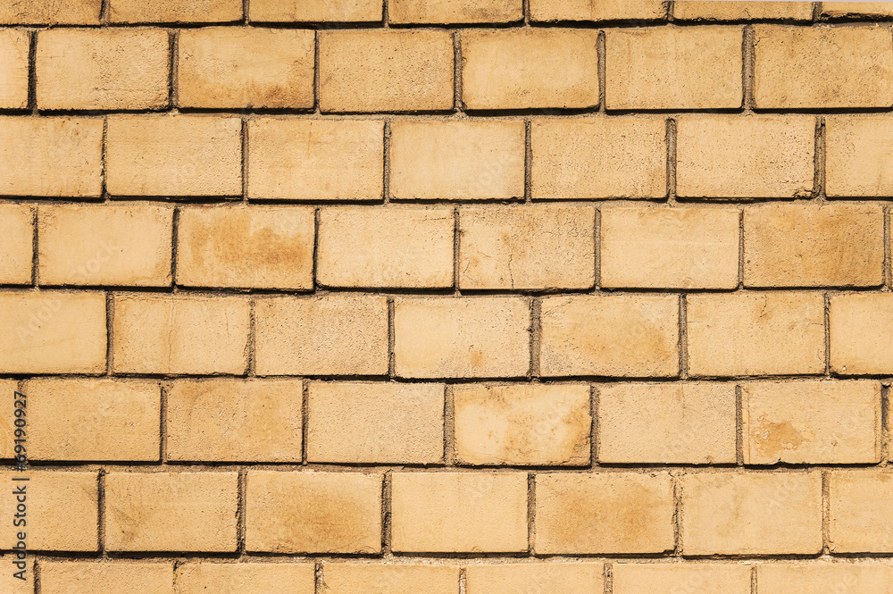 Obraz premium Yellow brick wall background