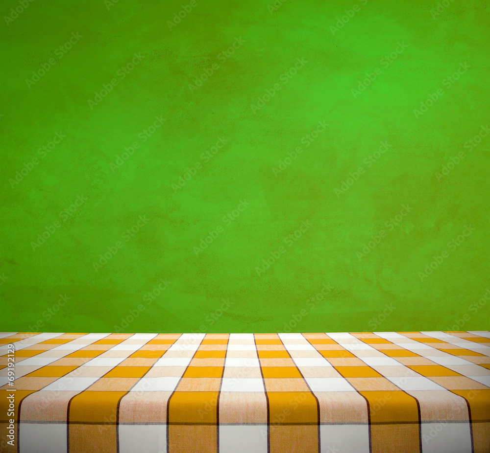 Yellow Tablecloth on Green Wall