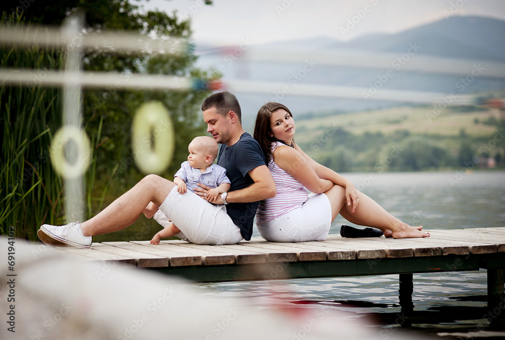 Family with baby on pier