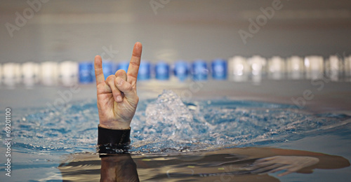 diving command hand on the water surface