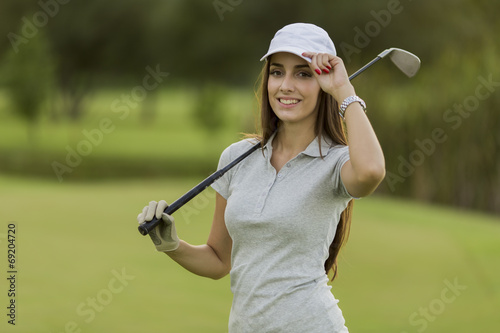 Young woman playing golf