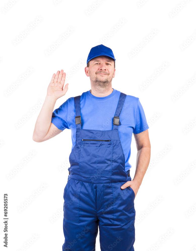 Worker in blue overalls.