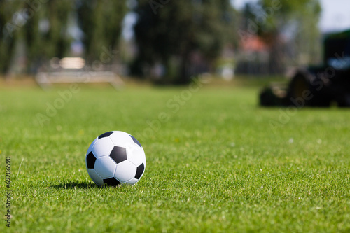 Green pitch with soccer ball