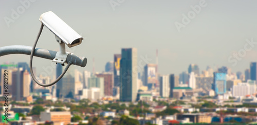 CCTV or surveillance operating with city in background