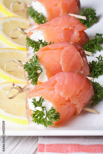 rolls with salmon, cream cheese and lemon closeup