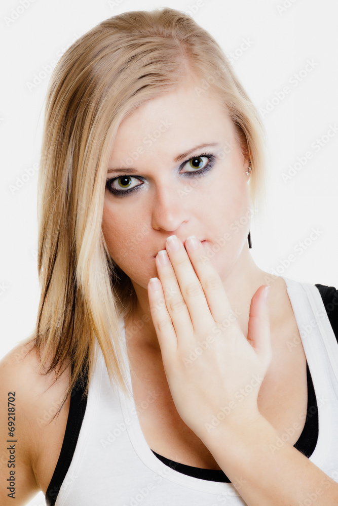 Surprised afraid girl covering mouth with hand Surprised afraid girl covering mouth with hand
