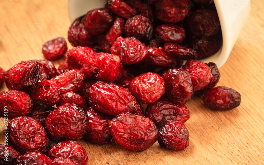 Dried cranberry fruit in bowl on table. Dried cranberry fruit in bowl on table.